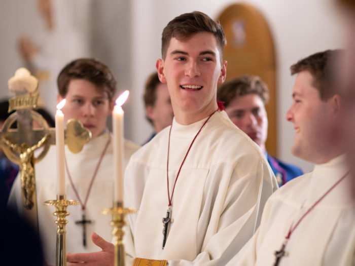 acolytes in chapel holding candles